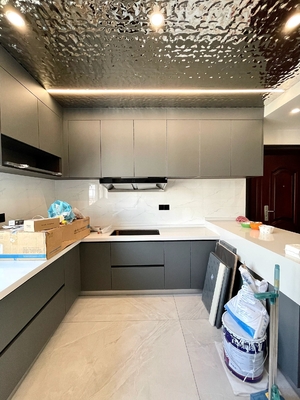 Modern High Gloss Kitchen Cabinets Featuring Elegant Stainless Steel Hardware